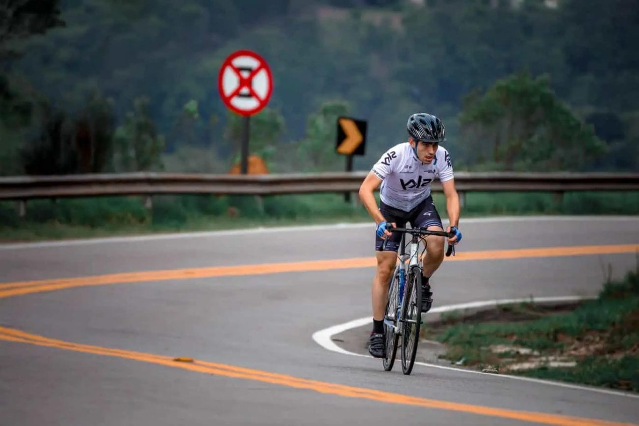 Cyclist biking uphill with strong mentality